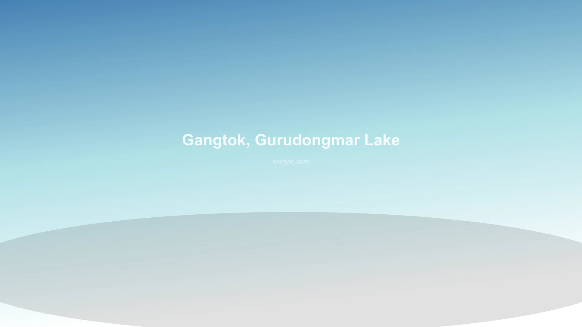 View of the blue waters of Gurudongmar Lake with snow mountains during Sairgah Serene North Sikkim Scenic Circuit